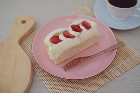 Strawberry Dessert on Pink Plate with Fork and Coffee Cupの写真素材