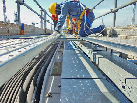 Worker are installing cable trayの写真素材