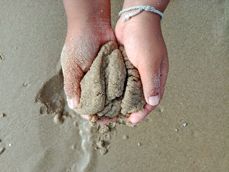 Child hand, Children playing the sandの写真素材