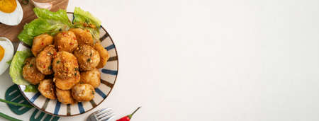 Top view of deep fried cuttlefish ball with salted egg coating and pepper seasoningの写真素材