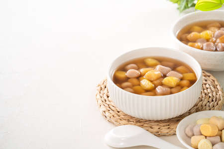 Close up of delicious sweet taro tapioca ball syrup soup in a white bowl for serving.の写真素材