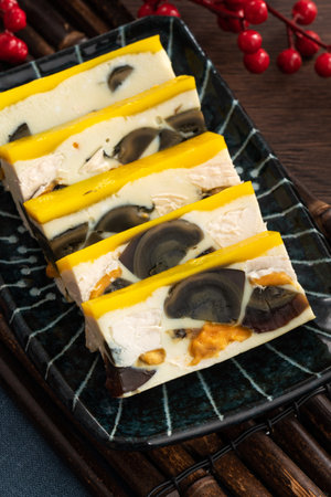 Delicious steamed three color egg made by mixing salted egg, pidan, and chicken egg. Taiwanese...