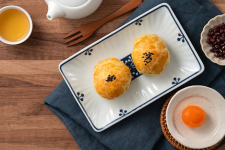 Moon cake yolk pastry, mooncake for Mid-Autumn Festival holiday on wooden table background.