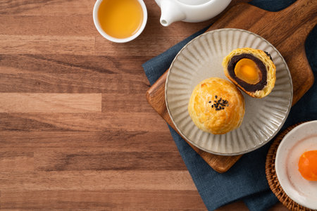 Moon cake yolk pastry, mooncake for Mid-Autumn Festival holiday on wooden table background.