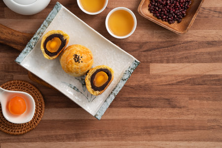 Moon cake yolk pastry, mooncake for Mid-Autumn Festival holiday on wooden table background.の写真素材