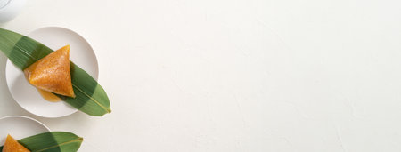 Zongzi, alkaline rice dumpling dessert, Dragon Boat Festival food with honey or sugar.の写真素材