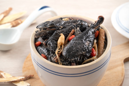 Delicoius silky chicken, black-boned chicken soup with Chinese herbal medicine.の写真素材