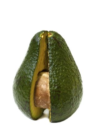 whole avocado standing and opened isolated on white backgroundの写真素材