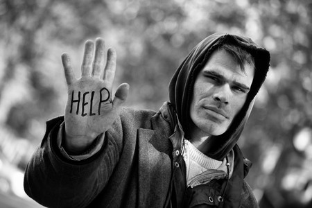 Homeless Men with hand outstretched: You can Help!の写真素材