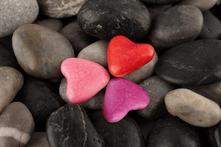 Three heart on pebblesの写真素材