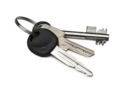 Car Key, Home Key and Safe Key on a keychain  isolated on white