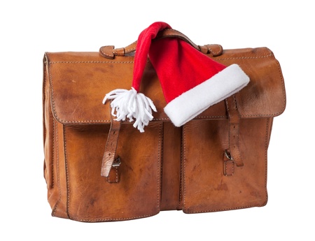 Vintage Briefcase with Santa Hat  isolated on white backgroundの写真素材
