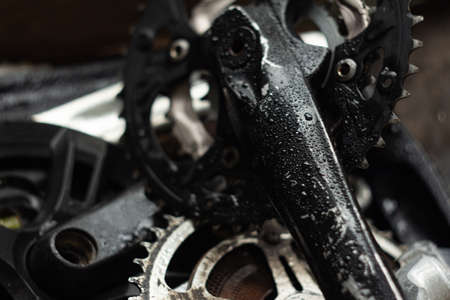 old bicycle cranks covered with morning dew