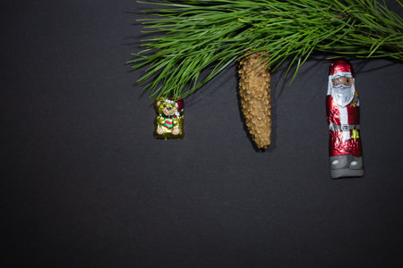 New Year theme - Christmas tree with a christmas tree cone with a toy - a chocolate bear and...