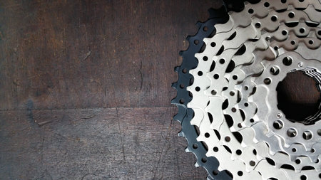 top view - stars from a 10 speed rear bicycle cassette on a dark wooden backgroundの写真素材