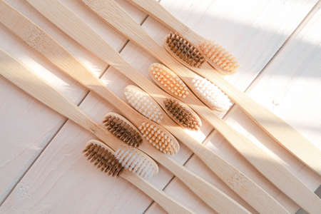 Zero waste bamboo toothbrush on eco wooden white background . High quality photoの写真素材