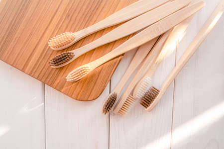 Zero waste bamboo toothbrush on eco wooden white background . High quality photoの写真素材