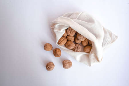 Eco bag with walnut on white background . High quality photoの写真素材