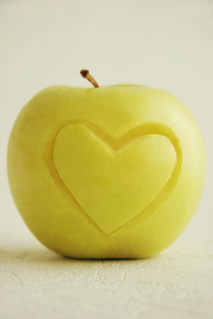 Yellow apple on a light background.の写真素材