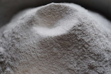 Wheat flour in a bowl, close-up, selective focus.の写真素材