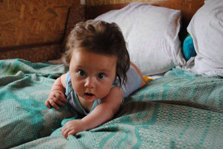 Happy little baby learning to crawlの写真素材