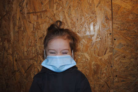 child in quarantine, girl in a maskの写真素材
