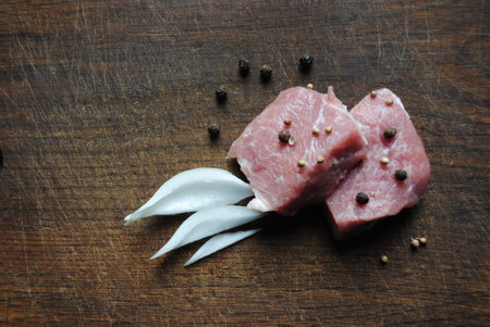 juicy appetizing meat with spices and onionsの写真素材