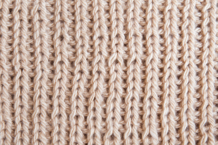 wallpaper background texture of a knitted brown beige sweater clの写真素材
