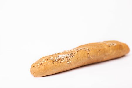 French baguette with sesame seeds on a white backgroundの写真素材