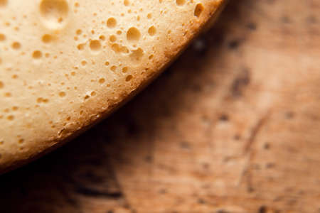sponge cake close-up on a wooden table top view with a place for textの写真素材