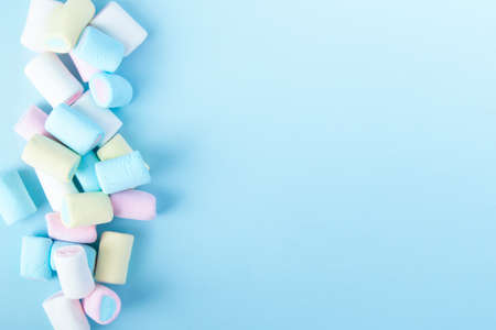 bright multi-colored marshmallows on a blue backgroundの写真素材