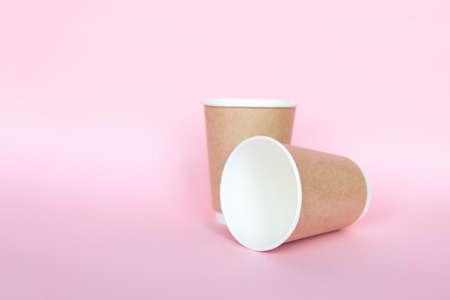 Set with disposable environmental paper utensils on pink backgroundの写真素材