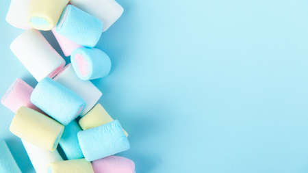 bright multi-colored marshmallows on a blue backgroundの写真素材
