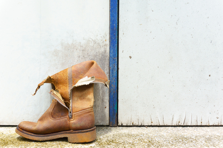 one old vintage damaged boot