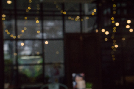 Blurred image and bokeh of light in cafe and bistro background.の写真素材
