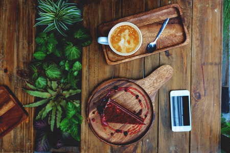 coffee, cake, velvet, red, cappuccino, cup, breakfast, white, latte, milk, sweet, morning, beans, food, wood, plate, art, table, cream, delicious, dessert, bakery, foam, slice, cafe, piece, top, baked, espresso, sugar, roasting, chocolate, drink, celebratの写真素材