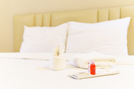 bathroom accessories preparation on the bed in a room of hotel or apartment. well and nice preparation of bath facilities for hotel services. set of bath services on the bed in hotel.の写真素材