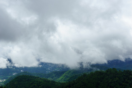 panorama dramatic view of valley with mist over the mountain and cloudy sky background in the...