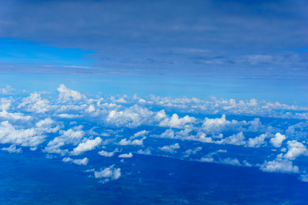 view of cloud and sky from the windows of airplane flying in sunny day at attitude 32000 feetsの写真素材