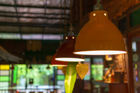 Colorful lamps hanging on the ceiling are turn on.の写真素材