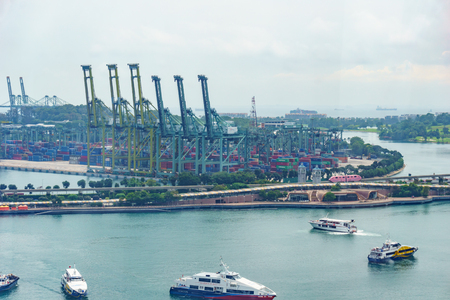 panorama landscape view of commercial port of singapore with cloudy sky. very busy port and important for logistic and transportation in asia. transportation concept.のeditorial素材