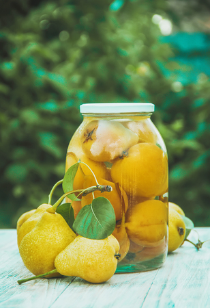 Preserved house pears in jars. Selective focus. foodの写真素材