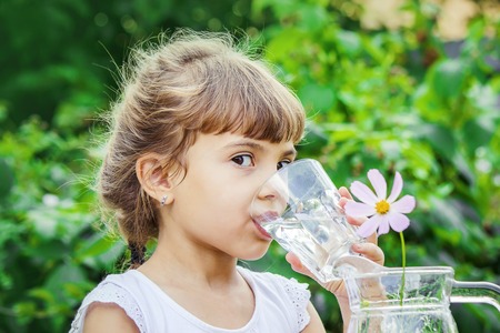 child glass of water. selective focus. Childrenの写真素材