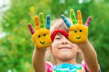 children hands in colors. Summer photo. Selective focus. natureの写真素材