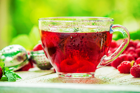 Raspberries on a wooden background. Selective focus. Teaの写真素材