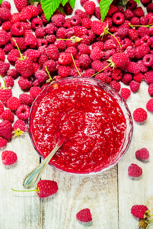 Raspberries on a wooden background. Selective focus. Tea