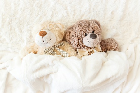 children's toy sleeps under the blanket. copy space. Selective focus. Kids.の写真素材