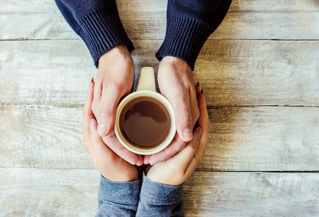 Cup drink for Breakfast in the hands of lovers. Selective focus. Nature.の写真素材