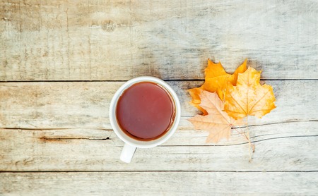 A cup of tea and a cozy autumn background. Selective focus. food.の写真素材