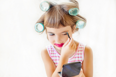 little fashion-girl. girl does her make up and manicure. selective focus. Children.の写真素材